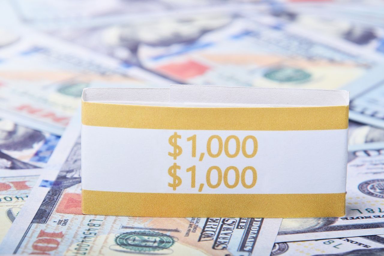 Focused view of US dollars wrapped in a currency band, perfect for finance and banking themes.